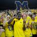 Michigan junior quarterback Denard Robinson "eats" with members of the Maize Rage during a taping of ESPN's College Game Day at Crisler Arena on Saturday morning. Melanie Maxwell I AnnArbor.com